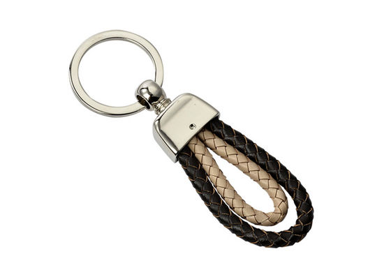Teça o suporte que feito a mão de confecção de malhas da chave do carro o plutônio trançou portas-chaves do couro da corda